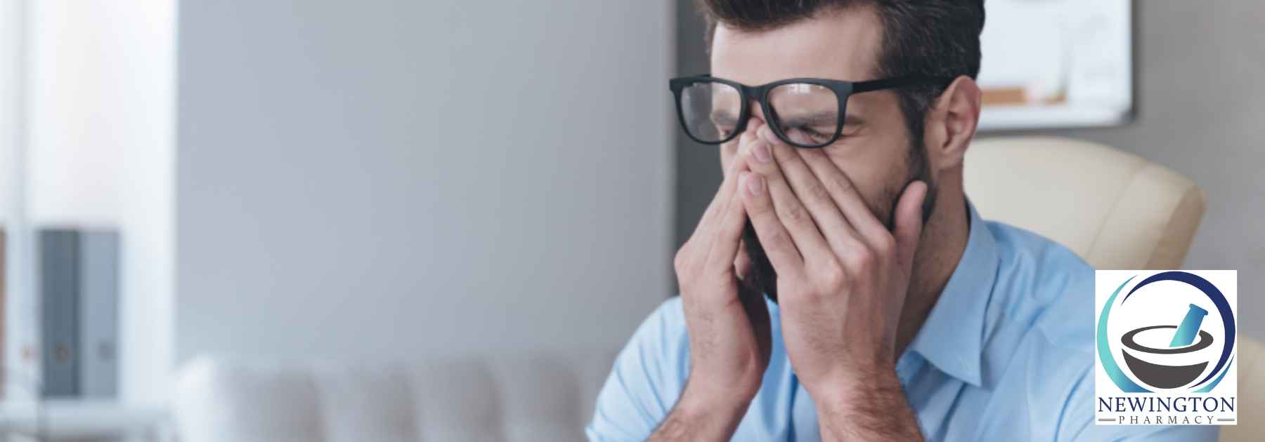 tired man rubbing his eyes