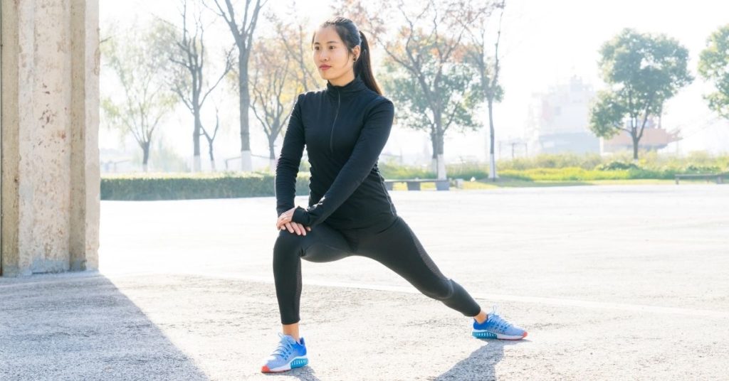 woman doing yoga outside