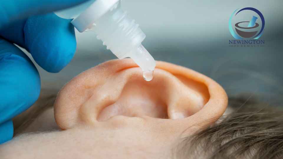 person using ear drops