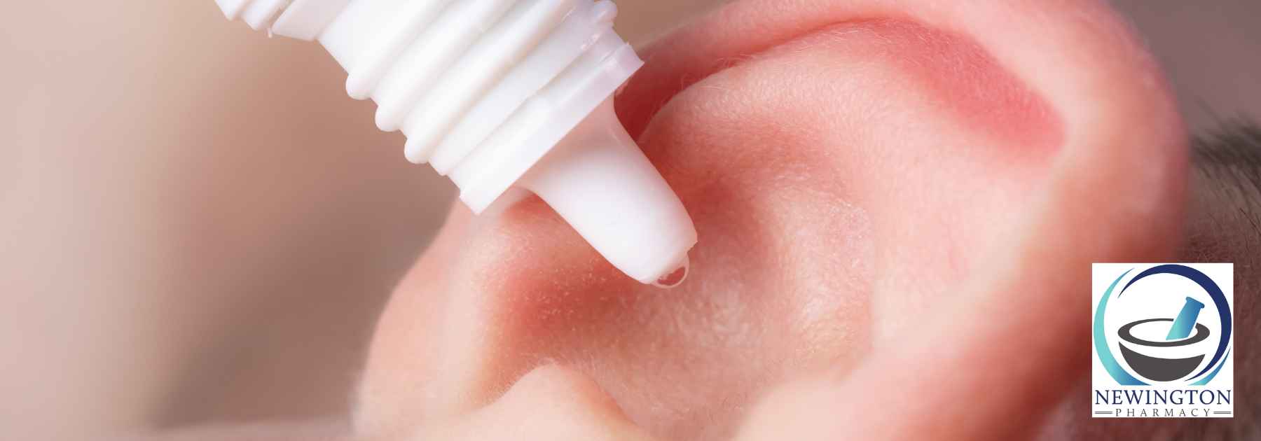 close-up of person using ear drops