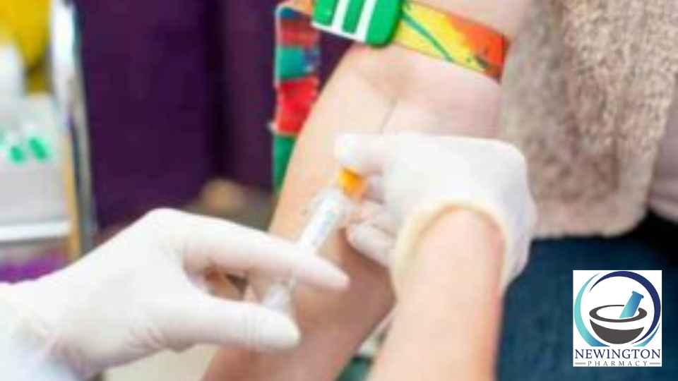 medical professional taking blood from patient's arm