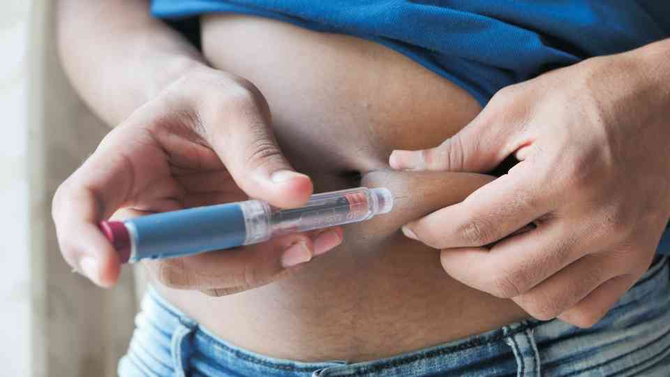 person using weight loss injection