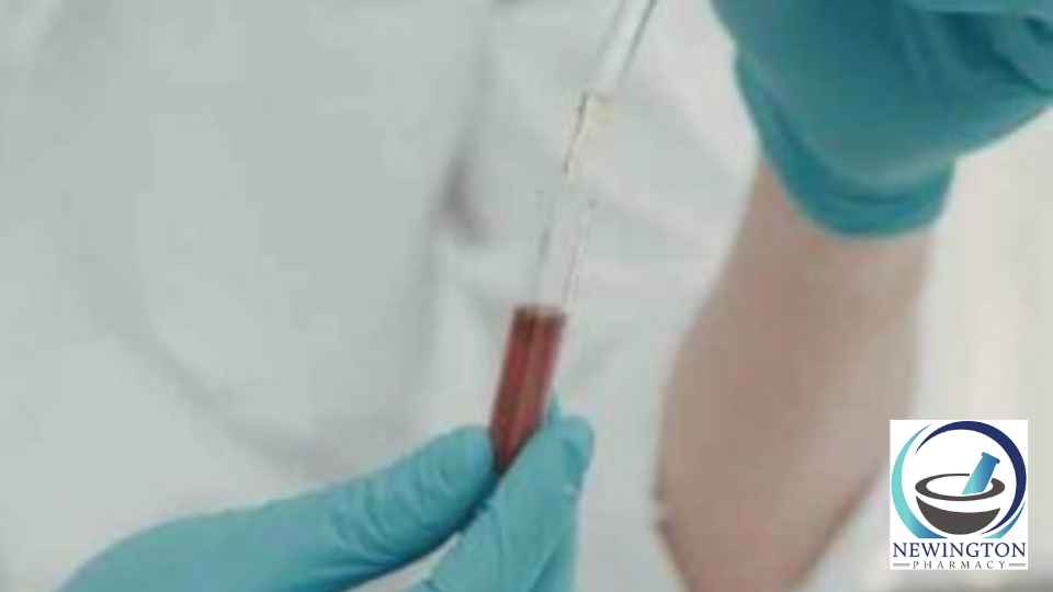 person in laboratory examining blood test