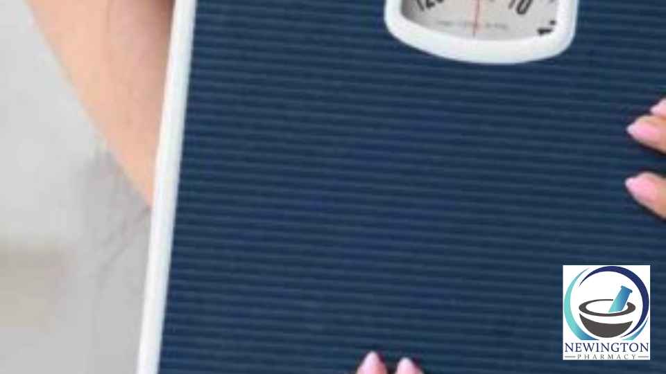 woman holding blue set of scales
