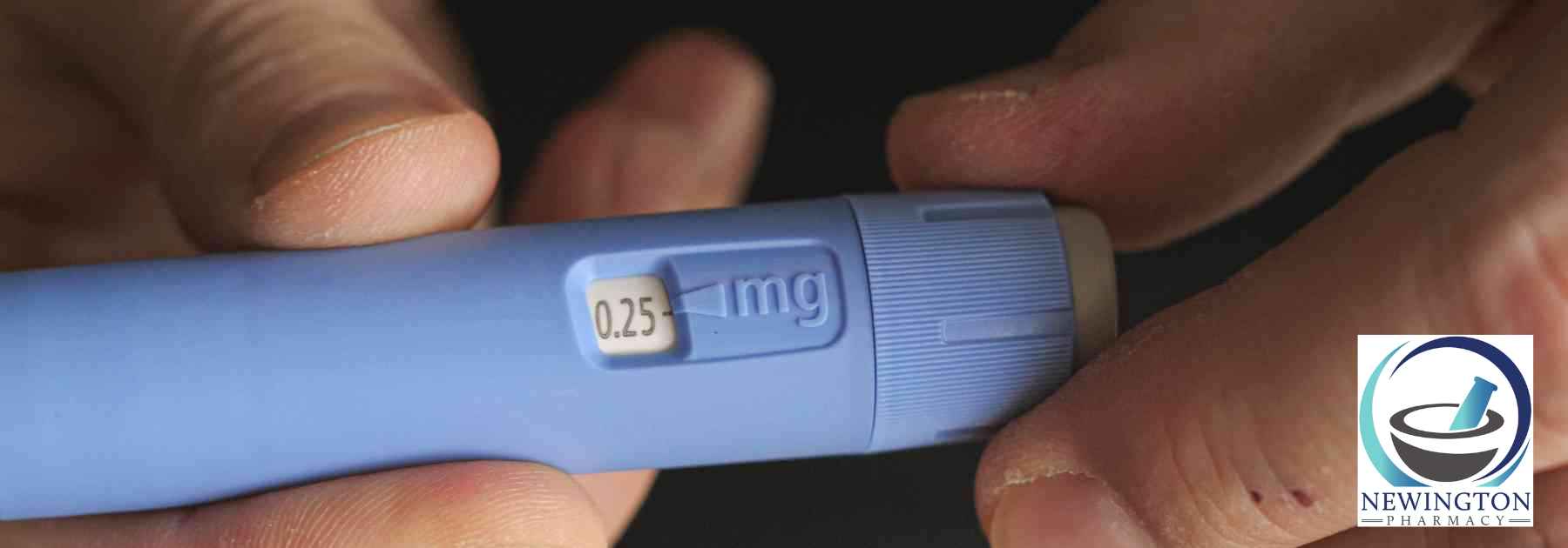 close-up of person holding weight loss injection