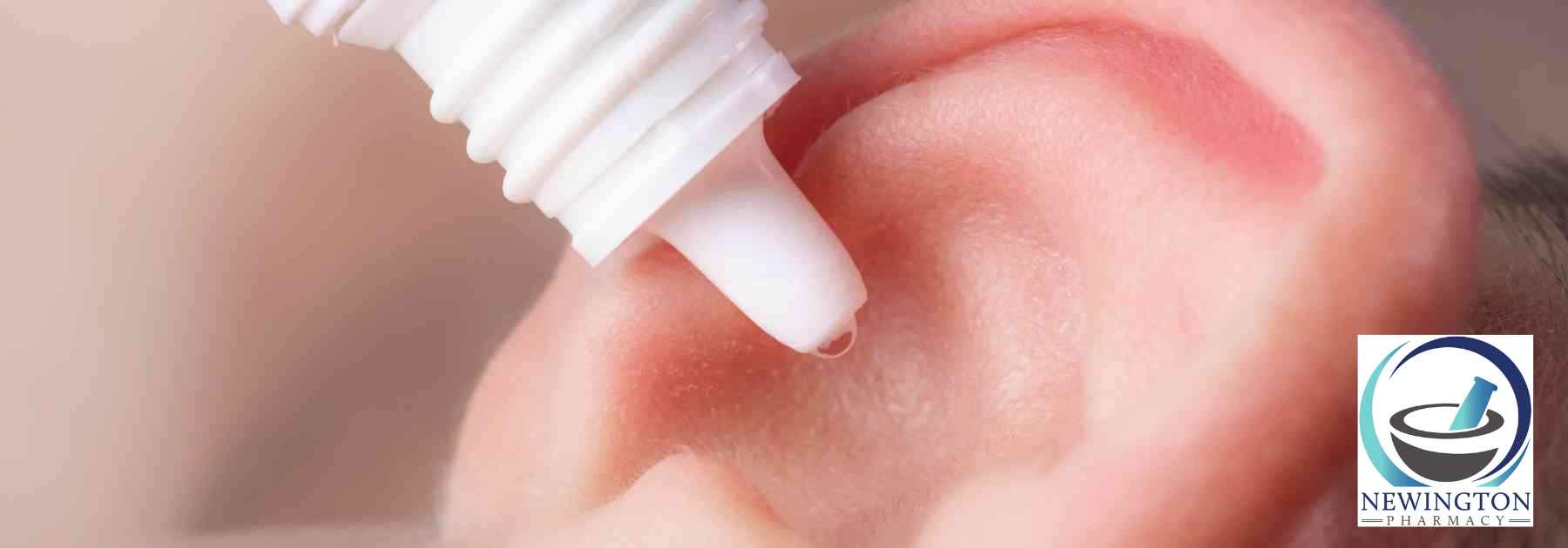 close-up of person putting ear drops in ear
