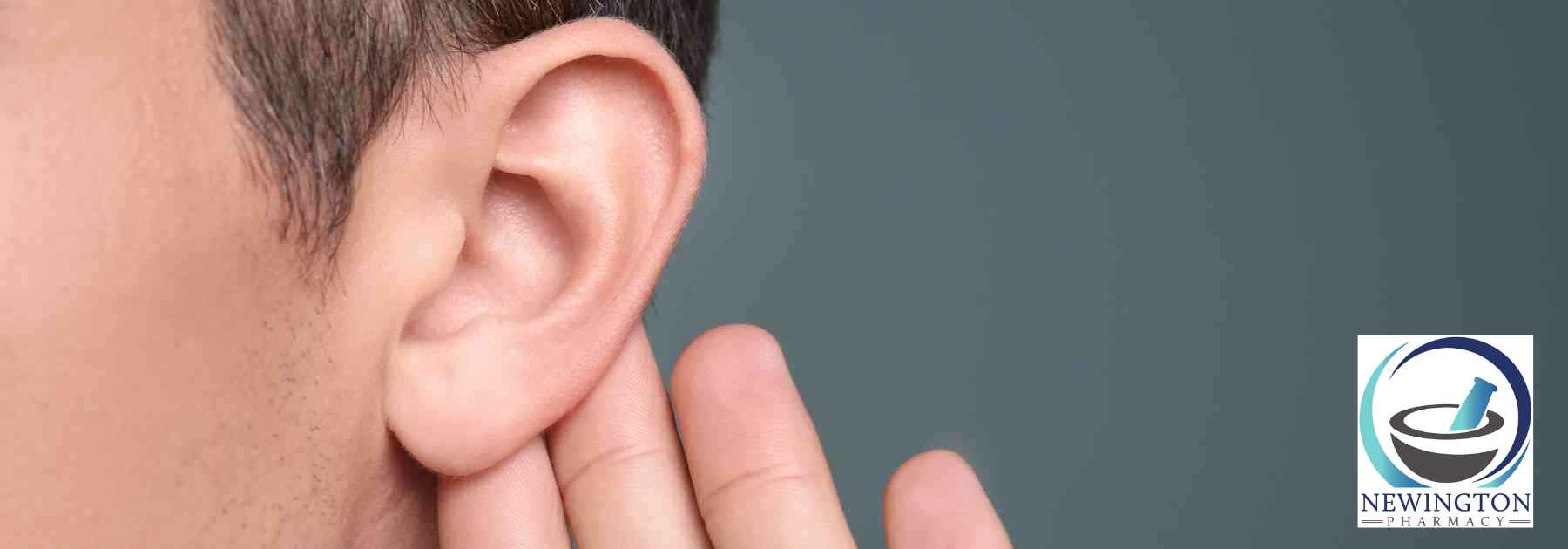 close-up of person holding their ear