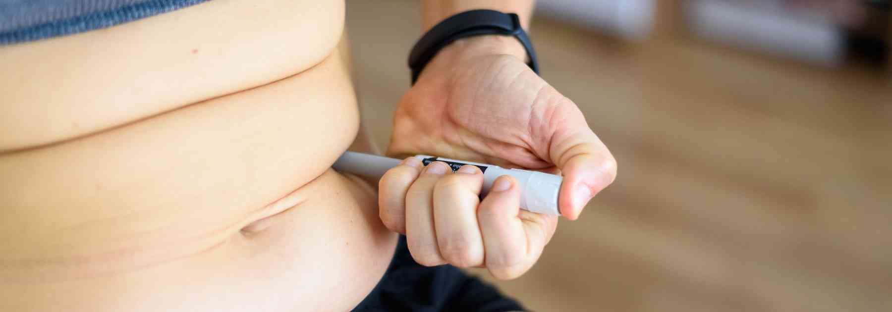 person using weight loss injection