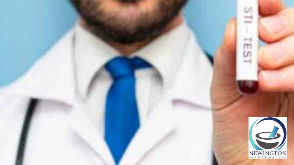 male doctor holding sti blood test