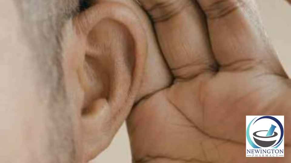 young man holding his ear