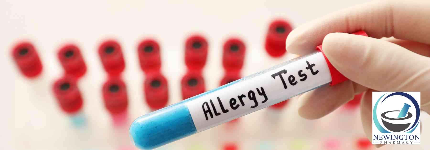 person wearing medical glove holding allergy blood test above other blood tests