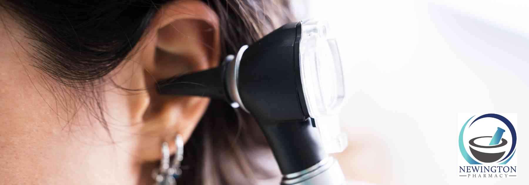 female patient having her ear examined