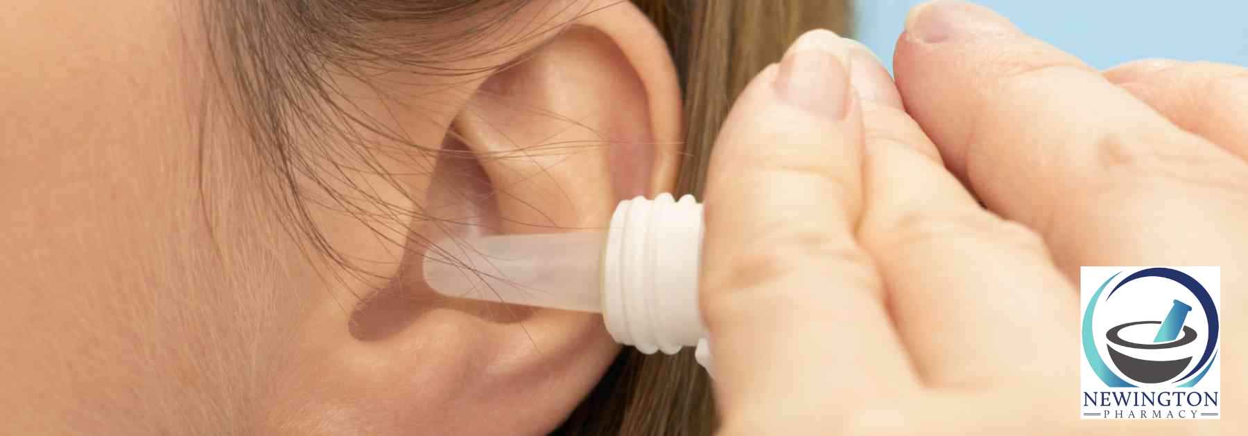 close-up of woman using ear drops
