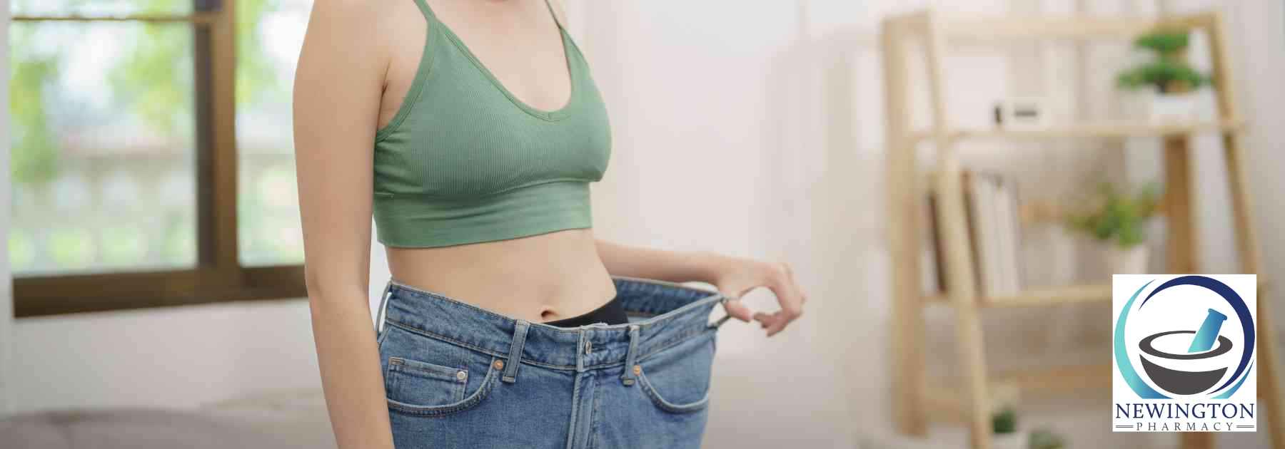 woman in green crop top wearing jeans too big