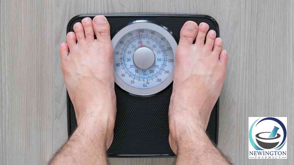 person in bare feet standing on scales