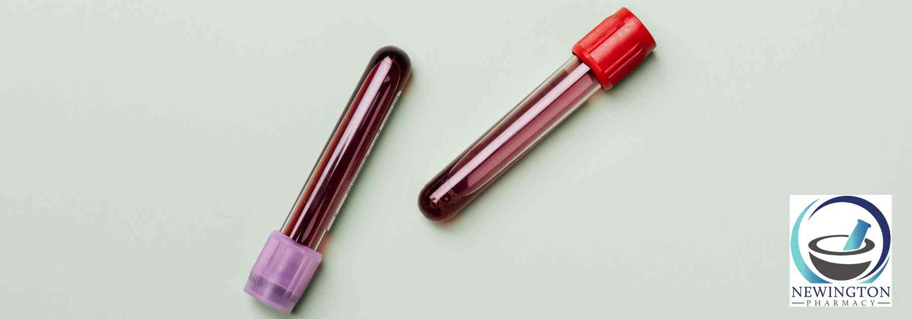 two blood tests lying on light green background