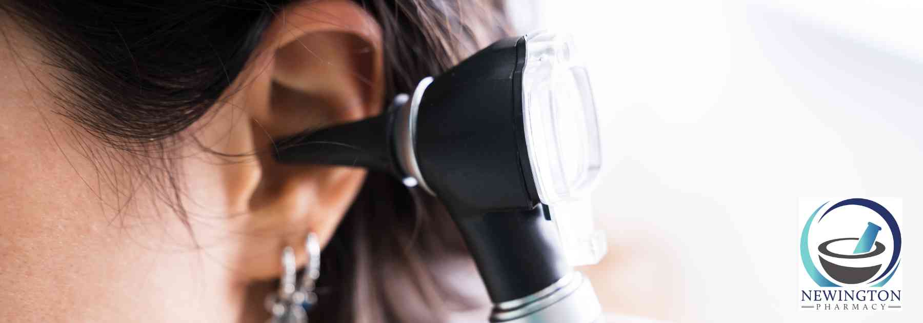 female patient having her ear examined
