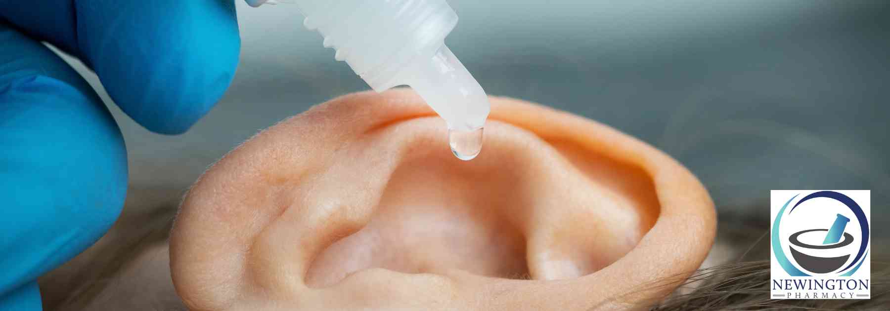 close-up of person using ear drops