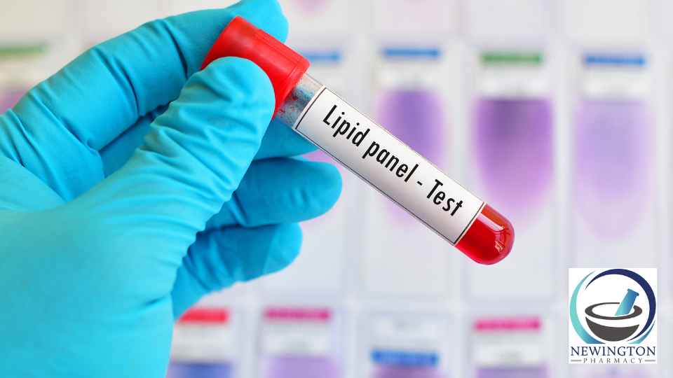 person wearing medical glove holding blood test labelled lipid panel