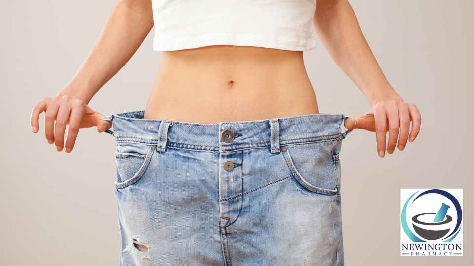 person in white crop top wearing jeans too big