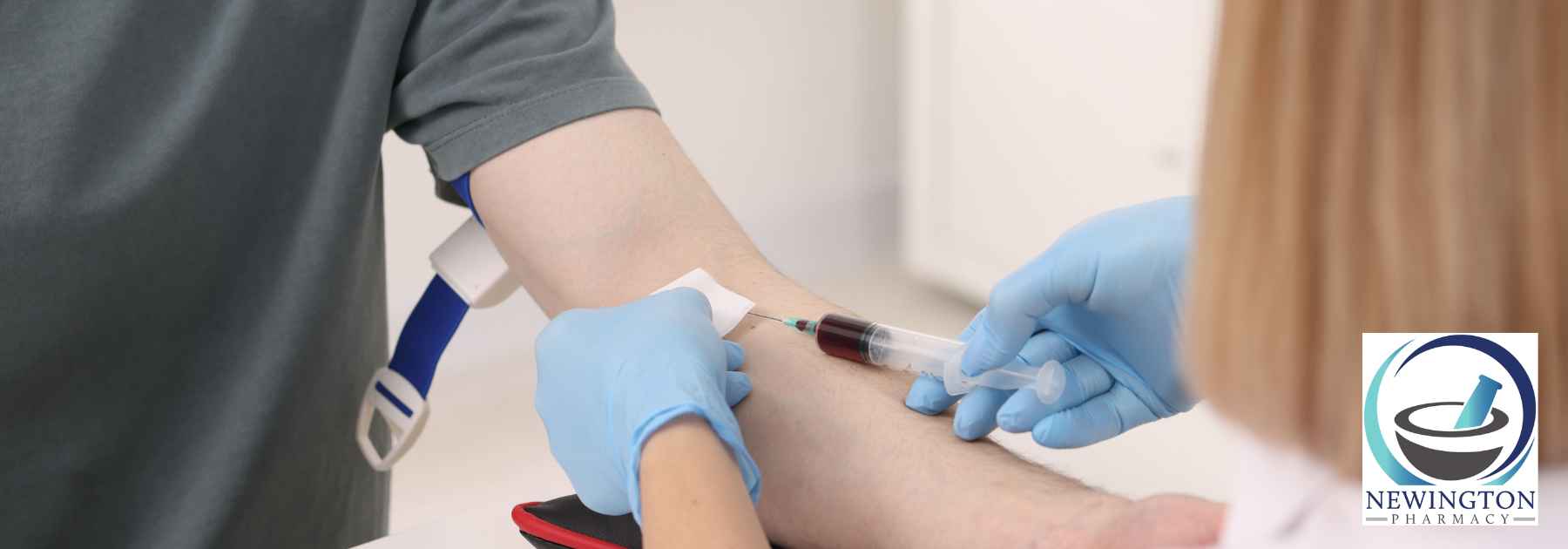patient in grey shirt at blood test appointment