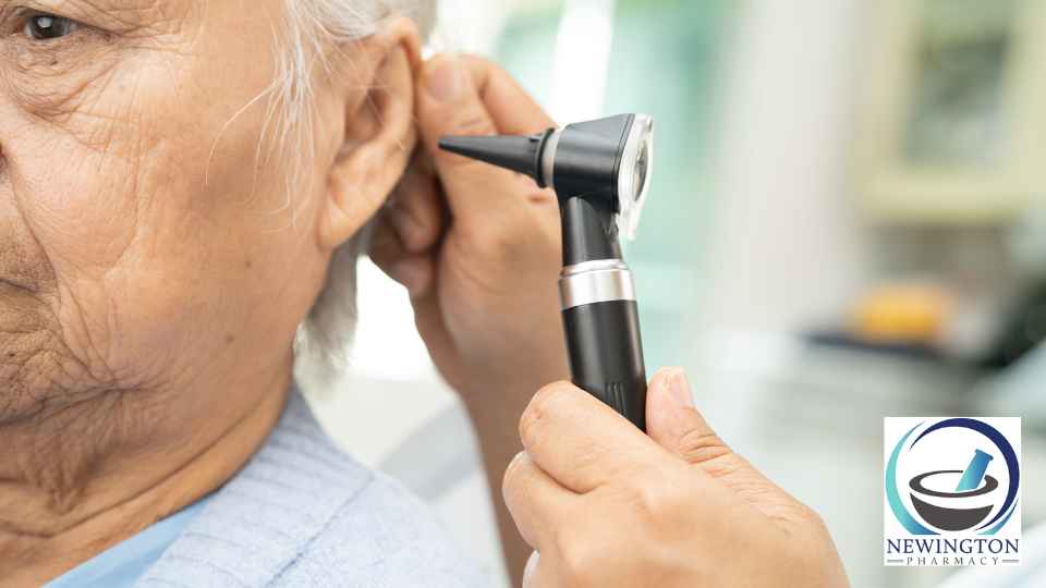 elderly patient having their ear examined